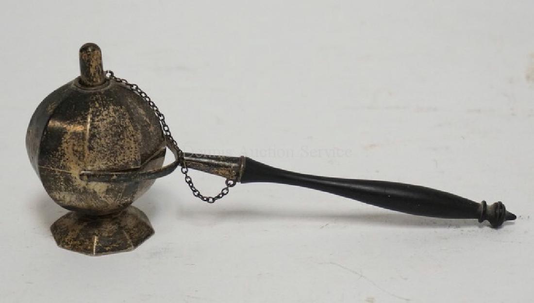 ANTIQUE STERLING SILVER OIL LAMP WITH A TURNED EBONY: ANTIQUE STERLING SILVER OIL LAMP WITH A TURNED EBONY HANDLE. MONOGRAMMED. 2 1/4 INCHES HIGH.