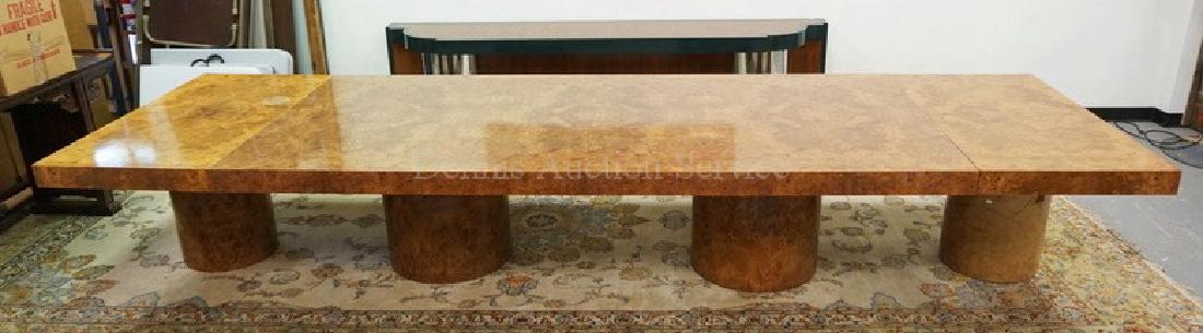 MASSIVE BURLED CONFERENCE TABLE WITH ROUND COLUMN: MASSIVE BURLED CONFERENCE TABLE WITH ROUND COLUMN BASES. 120 X 54 INCH TOP PLUS TWO 30 INCH END LEAVES EACH WITH THEIR OWN PEDESTALS. 30 INCHES HIGH. ONE LEAF WITH A 6 INCH SPOT IN THE FINISH.
