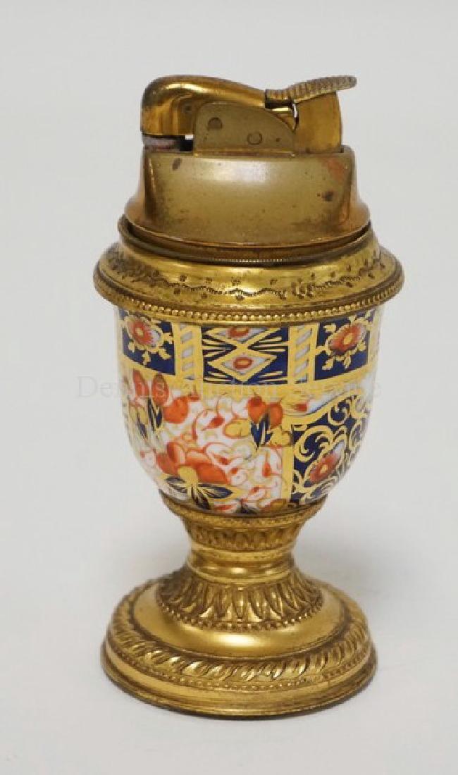 NICHOLAS HAYDON TABLE LIGHTER WITH A CROWN DERBY: NICHOLAS HAYDON TABLE LIGHTER WITH A CROWN DERBY PORCELAIN BODY. 4 1/4 INCHES HIGH.