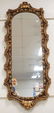 GOLD GILT WALL MIRROR MEASURING 49 X 20 1/4 INCHES.