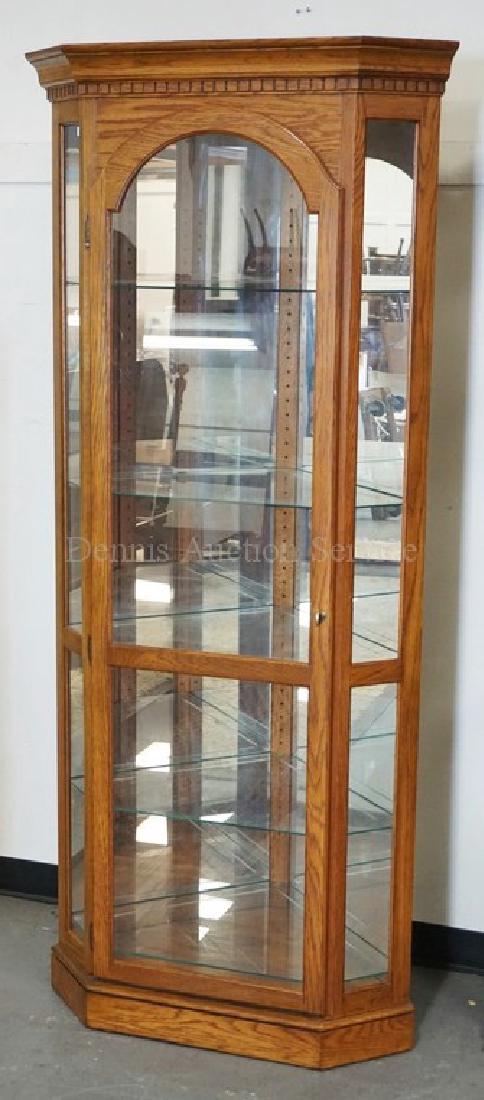 PHILIP REINISCH CORNER CURIO CABINET IN OAK. 80 INCHES (1 of 1)