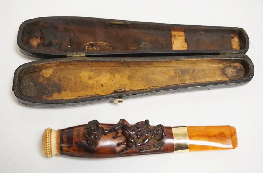LENOUVEL FRENCH CARVED CIGAR HOLDER FEATURING A RELIEF: LENOUVEL FRENCH CARVED CIGAR HOLDER FEATURING A RELIEF CARVED HUNTER CARRYING A FOX. 5 1/4 INCHES LONG. HAS ORIGINAL CASE.