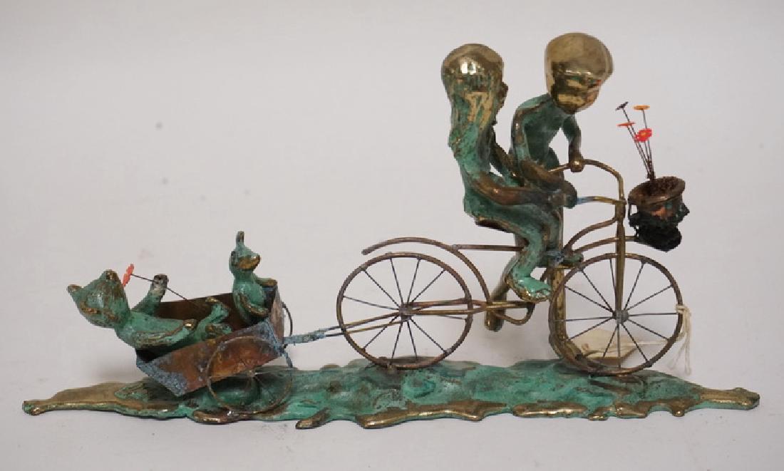 METAL SCULPTURE OF 2 CHILDREN WITH A BICYCLE AND A: METAL SCULPTURE OF 2 CHILDREN WITH A BICYCLE AND A TEDDY BEAR IN A CART. ARTIST SIGNED. 9 INCHES LONG.