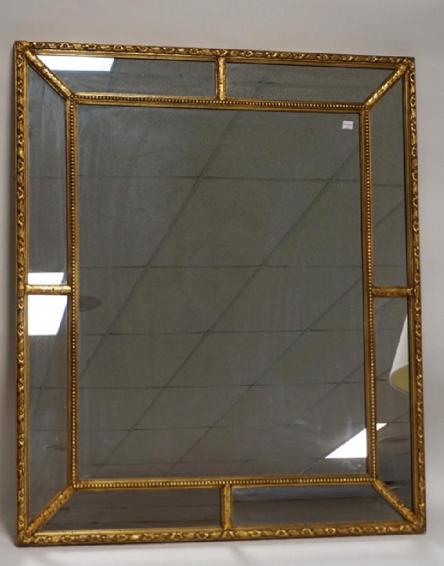 LARGE WALL MIRROR WITH A CARVED AND GOLD GILT FRAME. 33 (1 of 2)