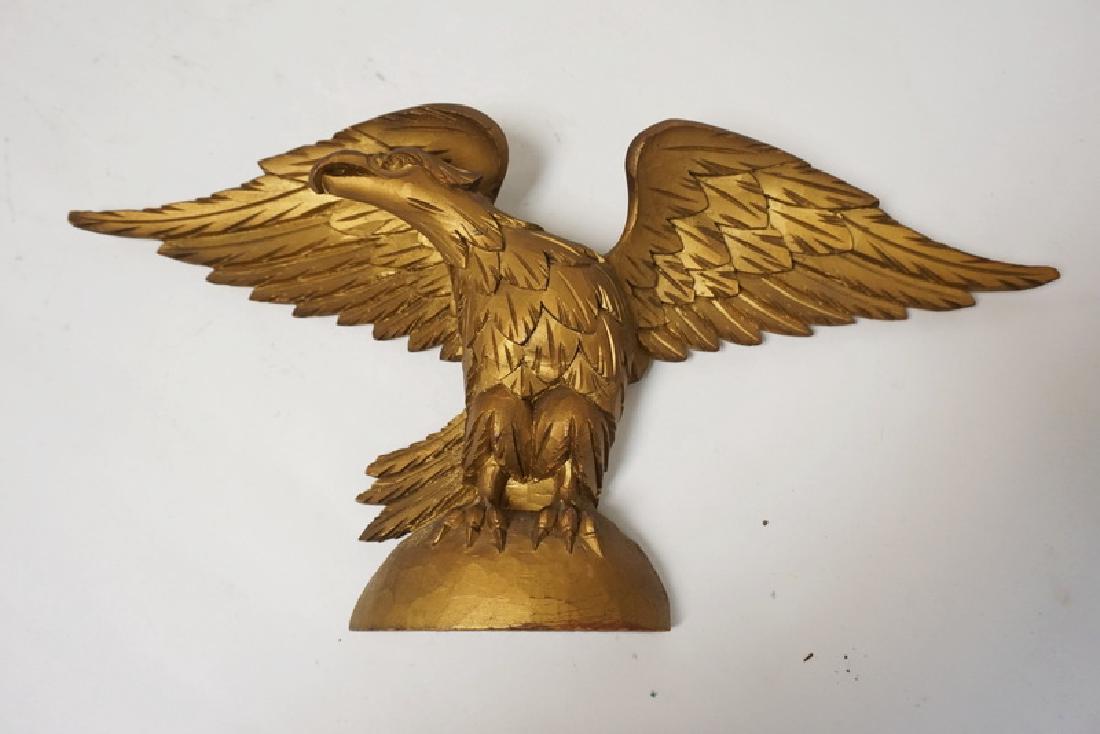 CARVED GILT WOOD EAGLE MEASURING 18 INCHES WIDE. (1 of 2)
