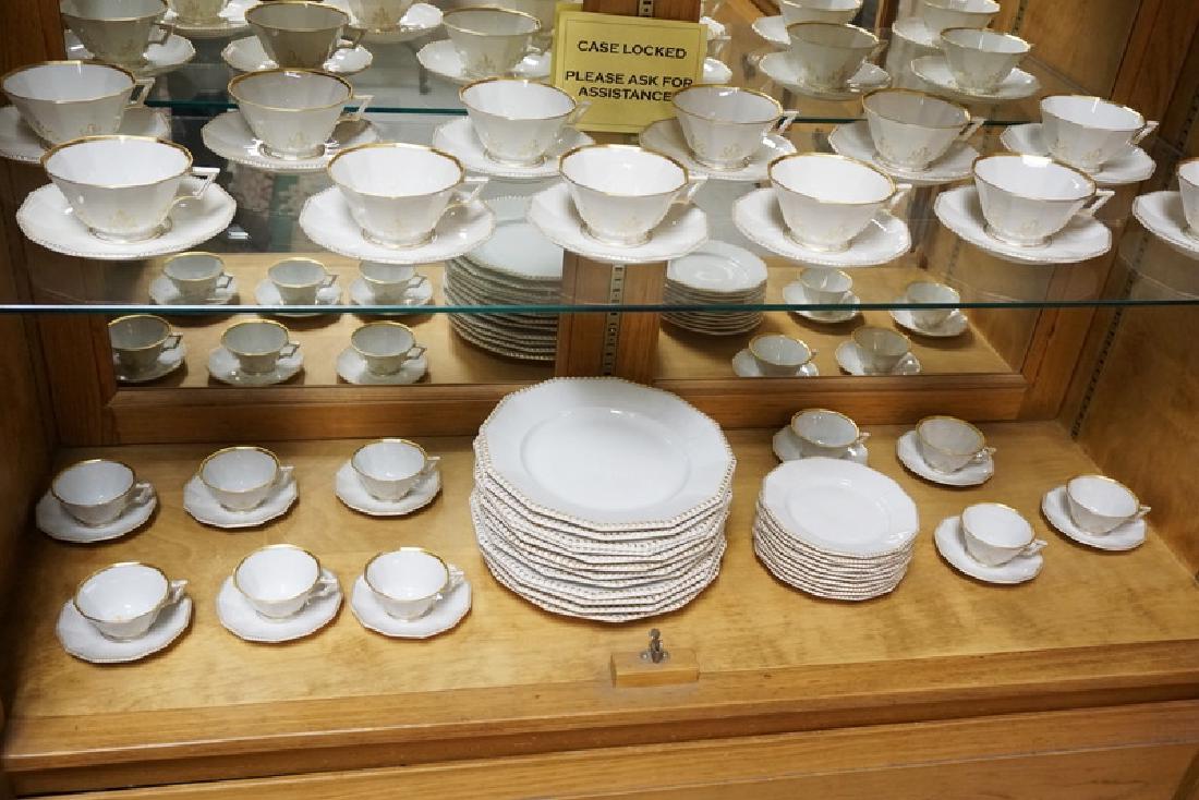 66 PIECE NYMPHENBURG DINNERWARE SET WITH GOLD TRIM. (1 of 2)