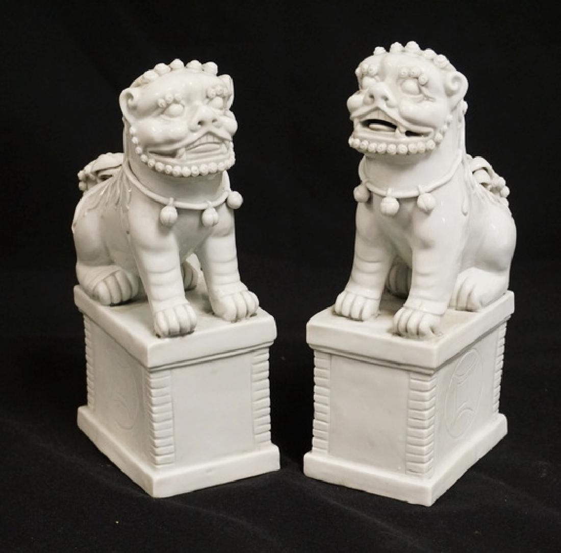 PAIR OF BLANC DE CHINE FOO DOG FIGURES. 7 1/4 INCHES (1 of 3)
