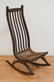 MID CENTURY MODERN ROCKING CHAIR WITH A CANE SEAT.