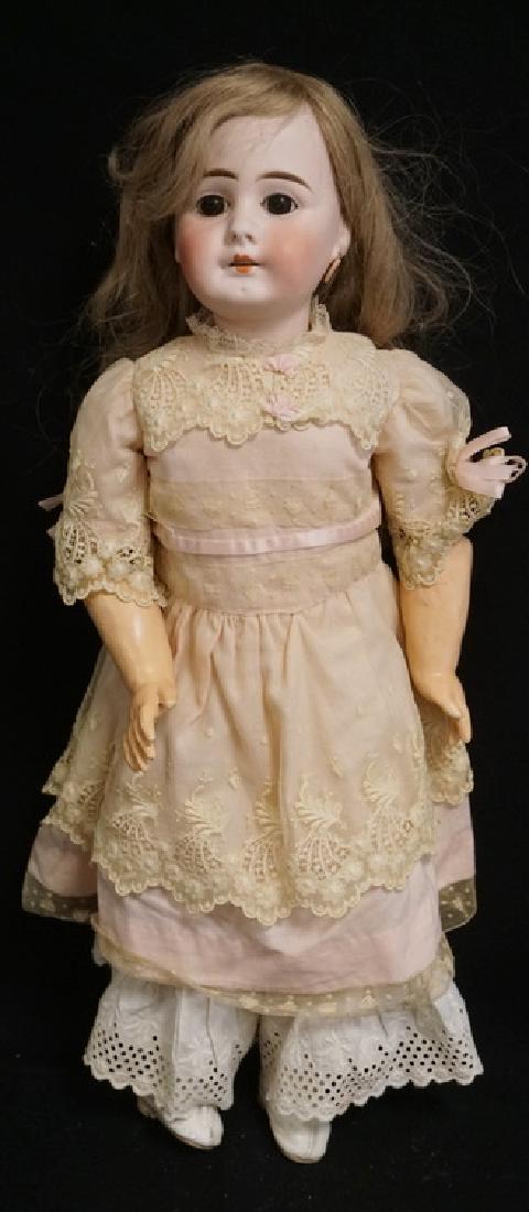 GERMAN BISQUE HEAD DOLL MEASURING 22 INCHES LONG. (1 of 2)