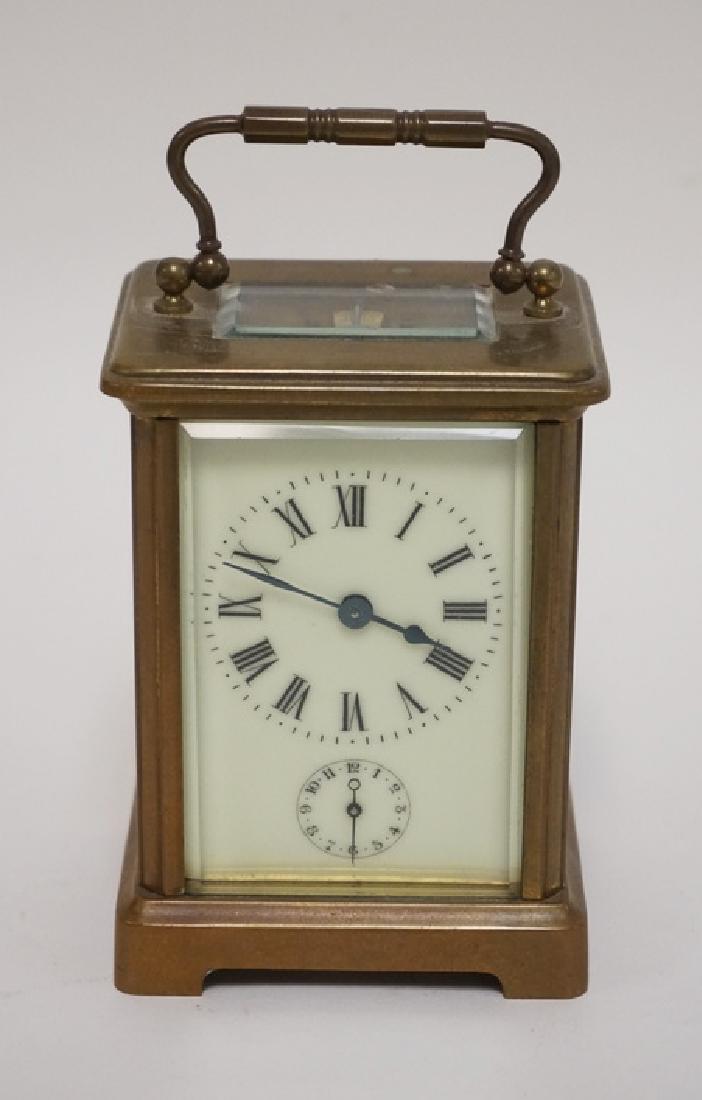 BRASS CARRIAGE CLOCK WITH BEVELED GLASS SIDES. (1 of 3)