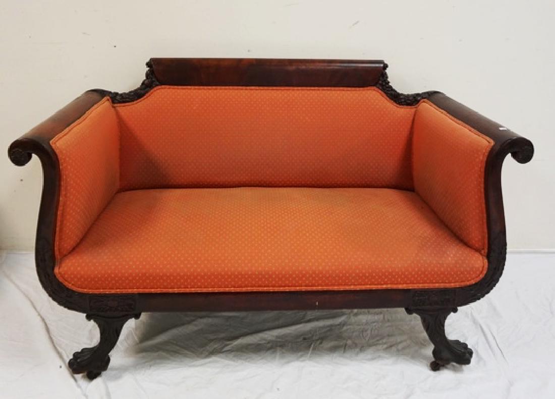 ANTIQUE CARVED MAHOGANY SETTEE WITH BERRIES, NUTS, AND: ANTIQUE CARVED MAHOGANY SETTEE WITH BERRIES, NUTS, AND ACANTHUS CARVINGS ALONG WITH PAW FEET. SCRATCHES TO ONE ARM. 55 1/2 INCHES WIDE. UPHOLSTERY IS SOILED.