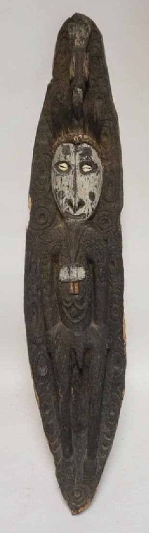 AFRICAN CARVED WOOD PANEL IN THE FORM OF A MAN WITH (1 of 1)