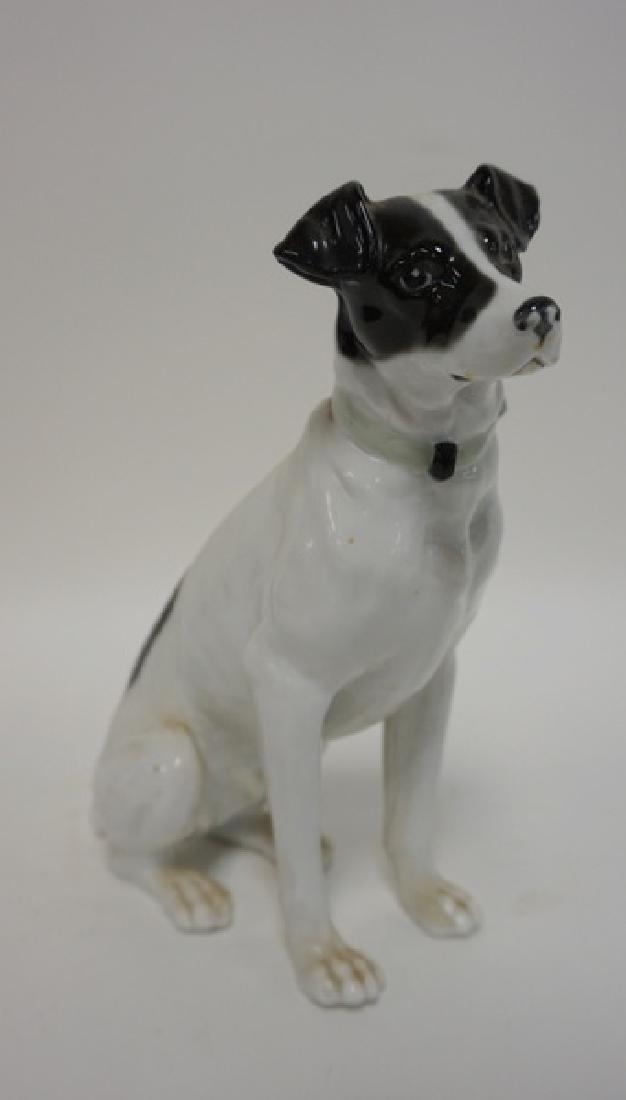PORCELAIN SITTING DOG. HAS MAKERS MARK UNDER FRONT (1 of 3)