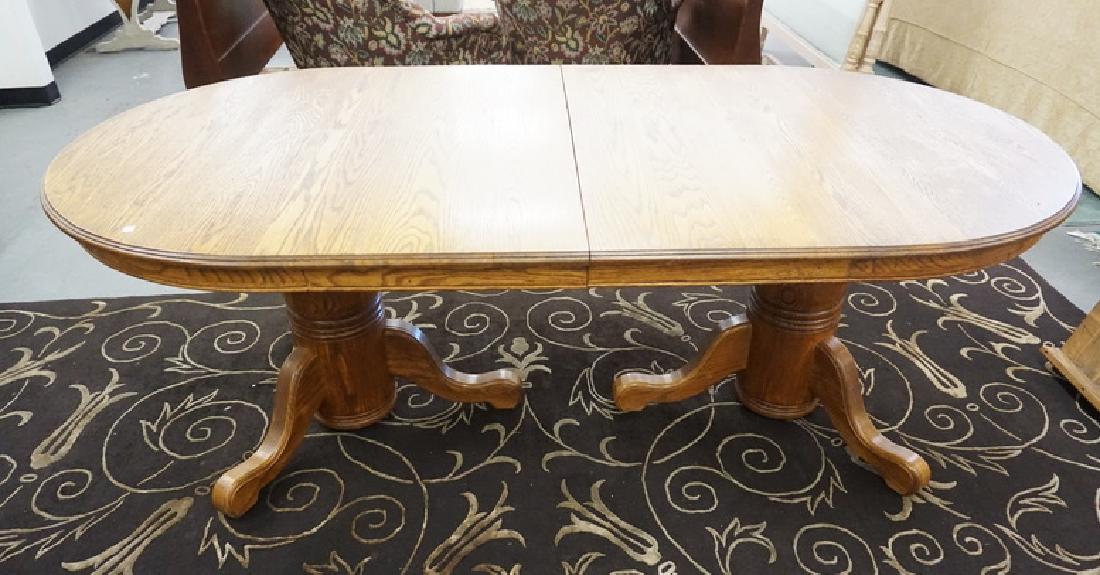 OVAL OAK DINING TABLE W/TWO 16 1/.2 IN LEAVES. 83 IN X (1 of 2)