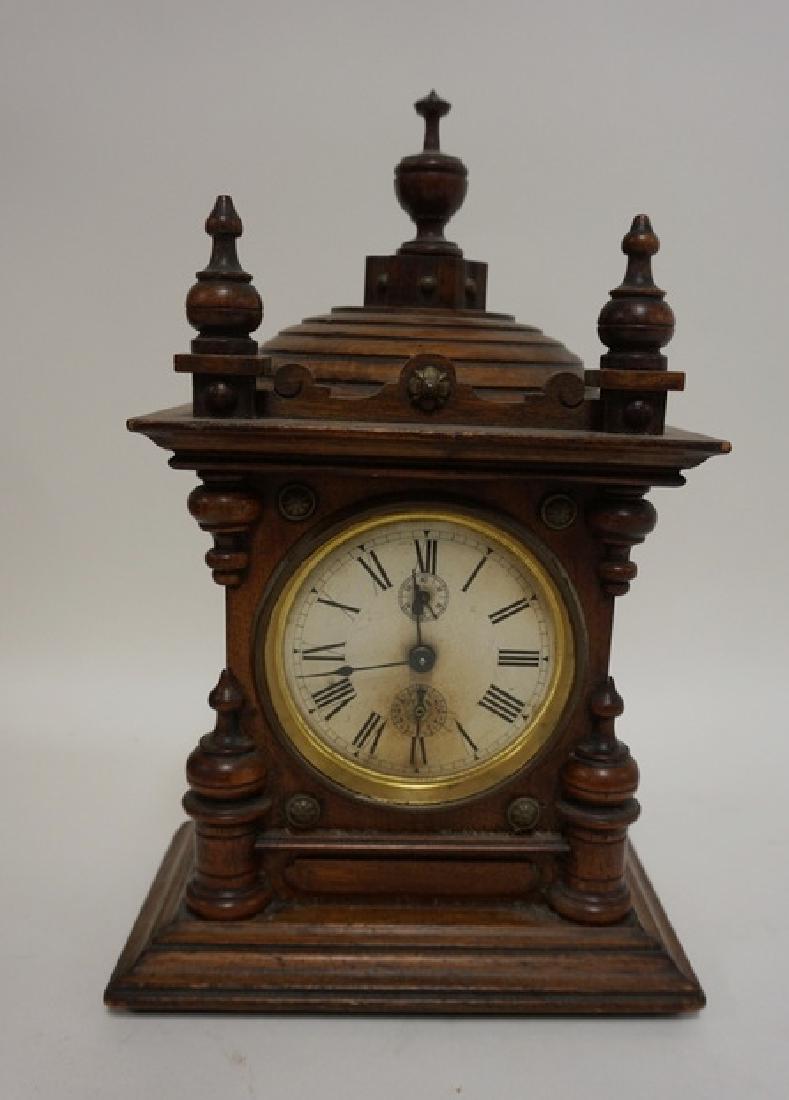 JUNGHANS VICTORIAN CLOCK IN CARVED CASE. 7 1/2 IN WIDE, (1 of 1)