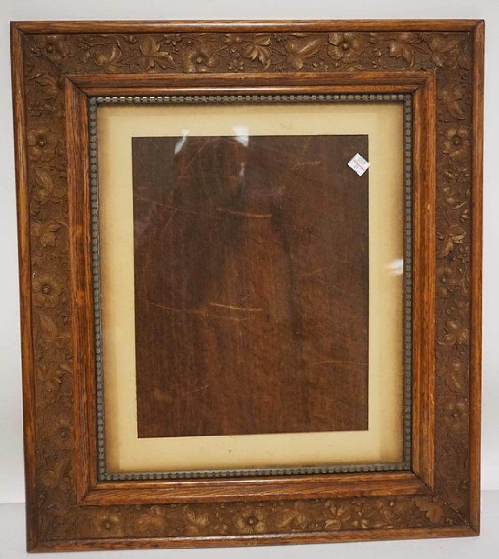 FLORAL AND LEAF CARVED OAK FRAME. OPENING 13 1/2 IN X (1 of 2)