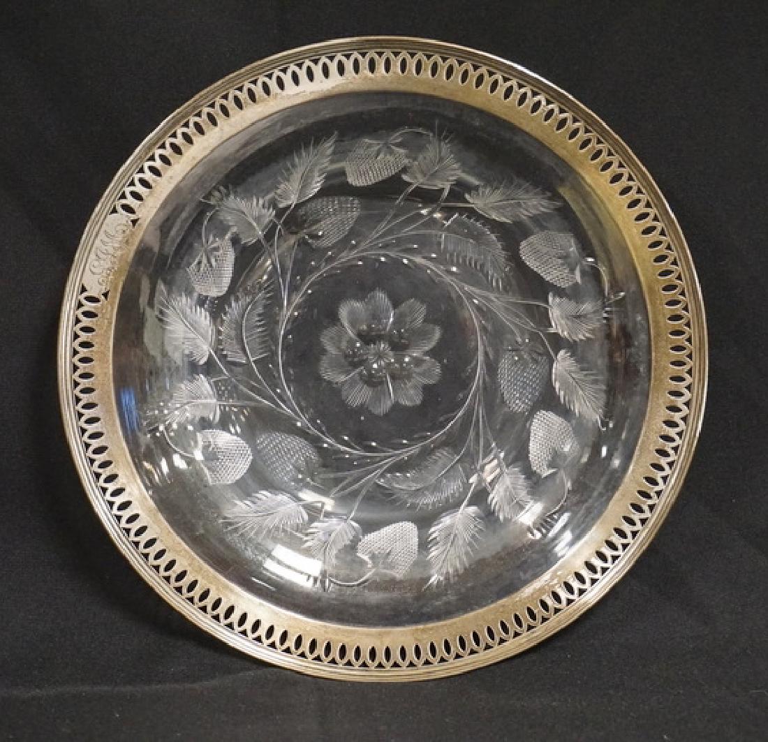 STRAWBERRY PATTERN CUT GLASS BOWL WITH REED AND BARTON: STRAWBERRY PATTERN CUT GLASS BOWL WITH REED AND BARTON STERLING SILVER RIM. HAS MINERAL DEPOSITS. MONOGRAMMED. 10 3/8 IN DIA