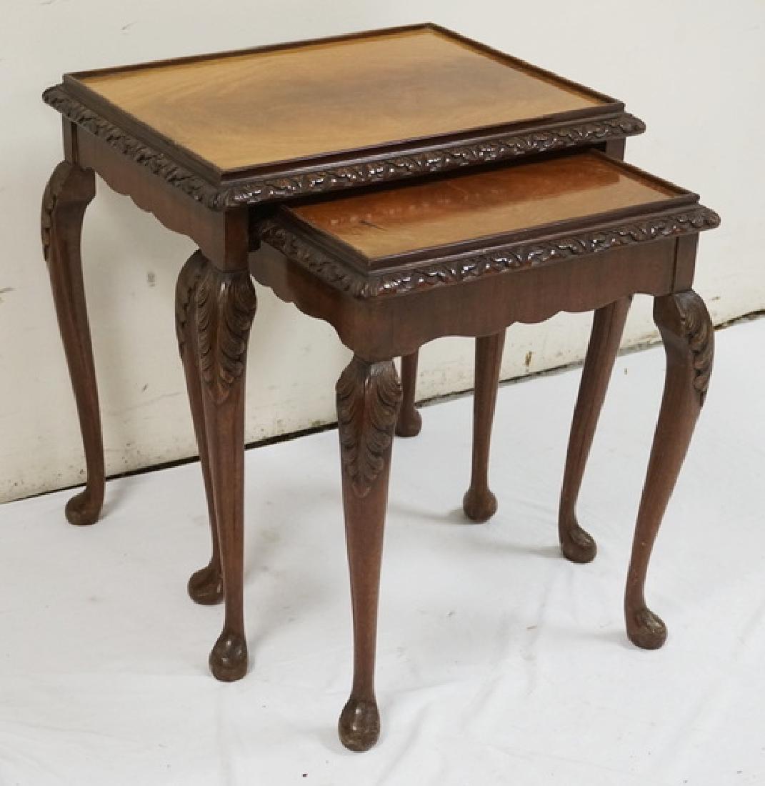 NEST OF 2 CARVED MAHOGANY OCCASIONAL TABLES WITH GLASS: NEST OF 2 CARVED MAHOGANY OCCASIONAL TABLES WITH GLASS TOPS.