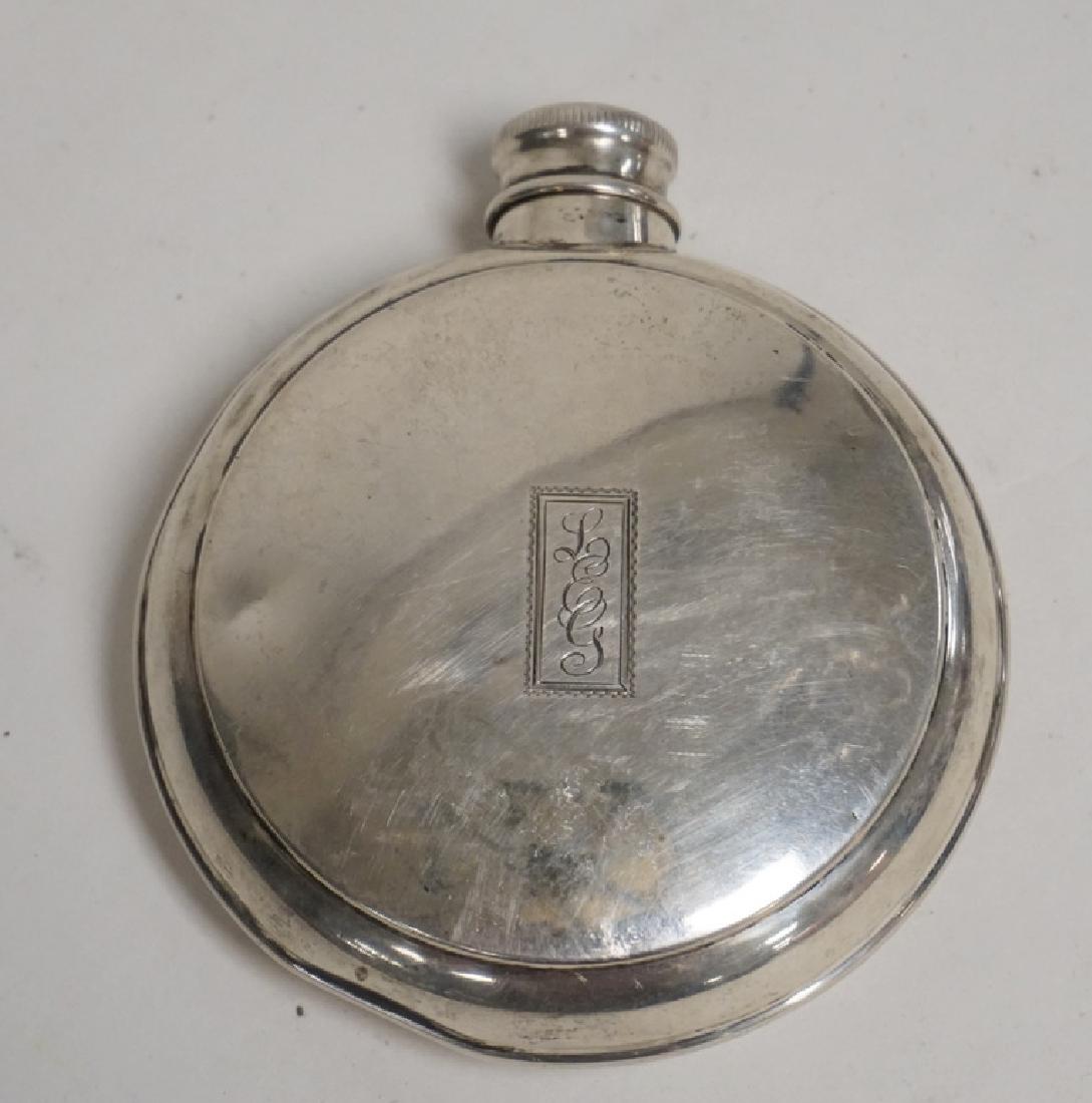 STERLING SILVER FLASK. 3 7/8 INCHES TALL. MONOGRAMMED.: STERLING SILVER FLASK. 3 7/8 INCHES TALL. MONOGRAMMED. HAS A DENT IN THE BOTTOM. 2.01 TROY OZ.