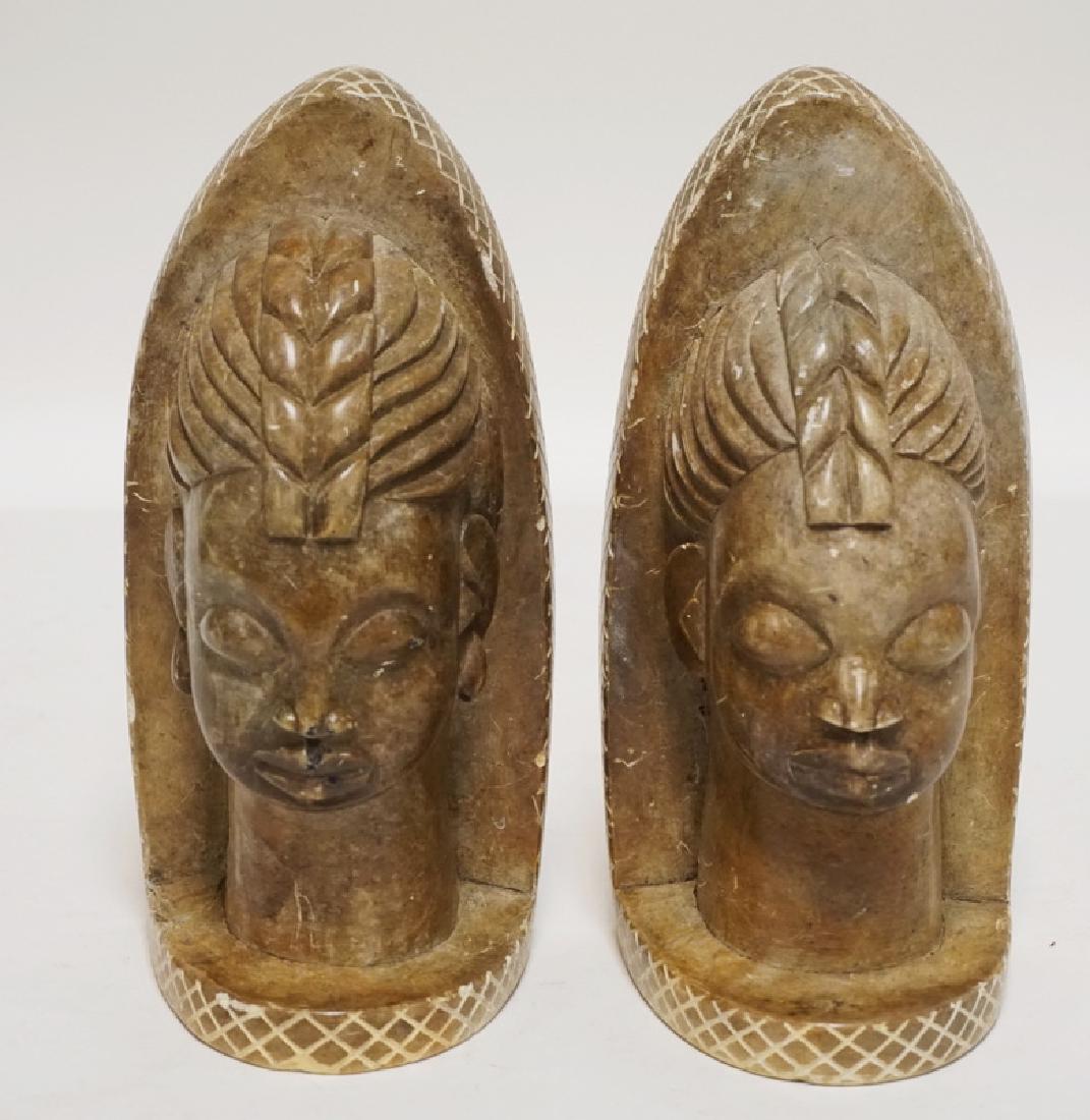PAIR OF CARVED STONE BOOKENDS. 8 1/2 INCHES HIGH. (1 of 2)
