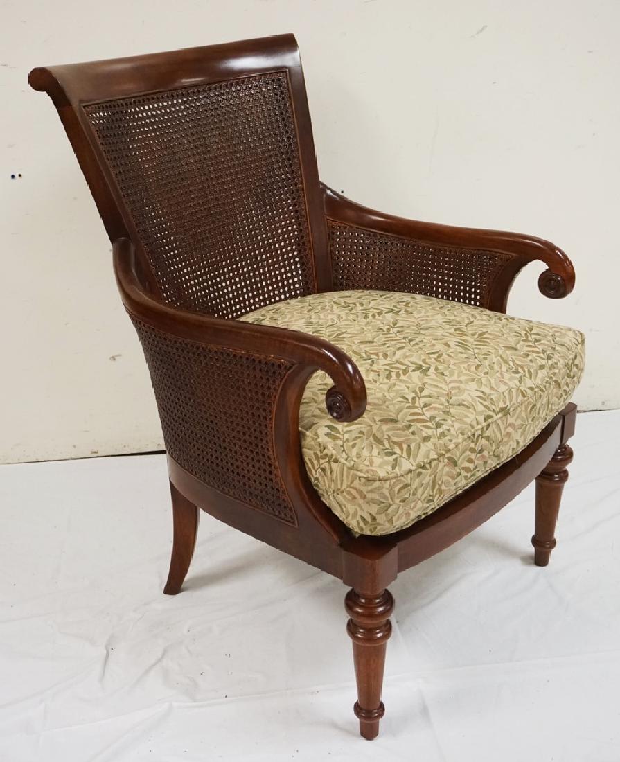 CANE BACK ARMCHAIR WITH AN UPHOLSTERED CUSHION. *MARK (1 of 2)