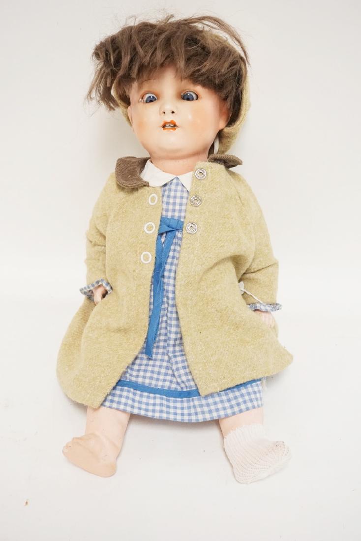 GERMAN BISQUE HEAD DOLL MEASURING 15 1/2 INCHES LONG. (1 of 2)