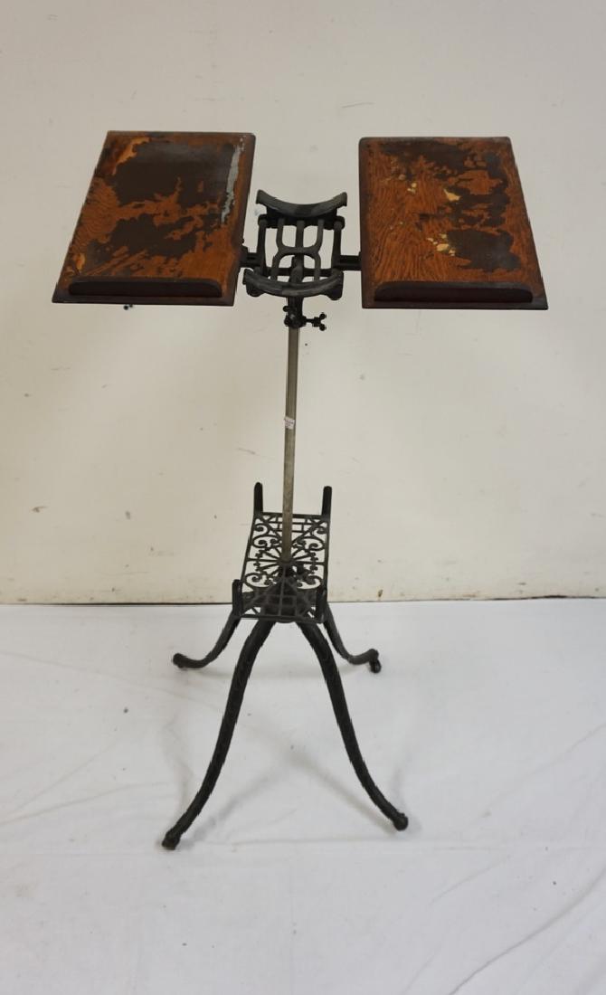 OAK MUSIC STAND WITH CAST IRON BASE. 41 3/4 IN WIDE (1 of 1)