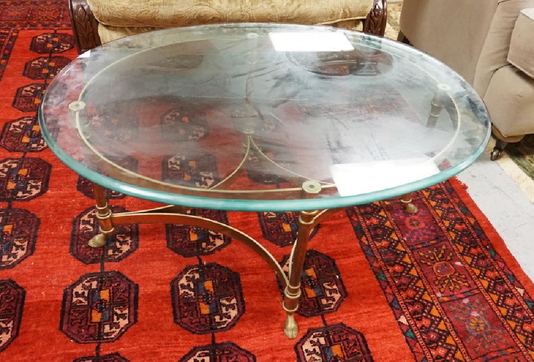BRASS BASE GLASS TOP OVAL COFFEE TABLE WITH HOOF FEET. (1 of 1)