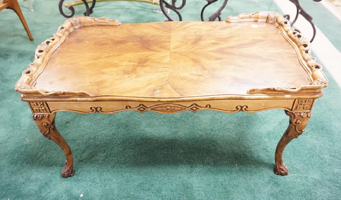 CARVED MAHOGANY COFFEE TABLE WITH PATTERNED VENEER TOP. (1 of 1)