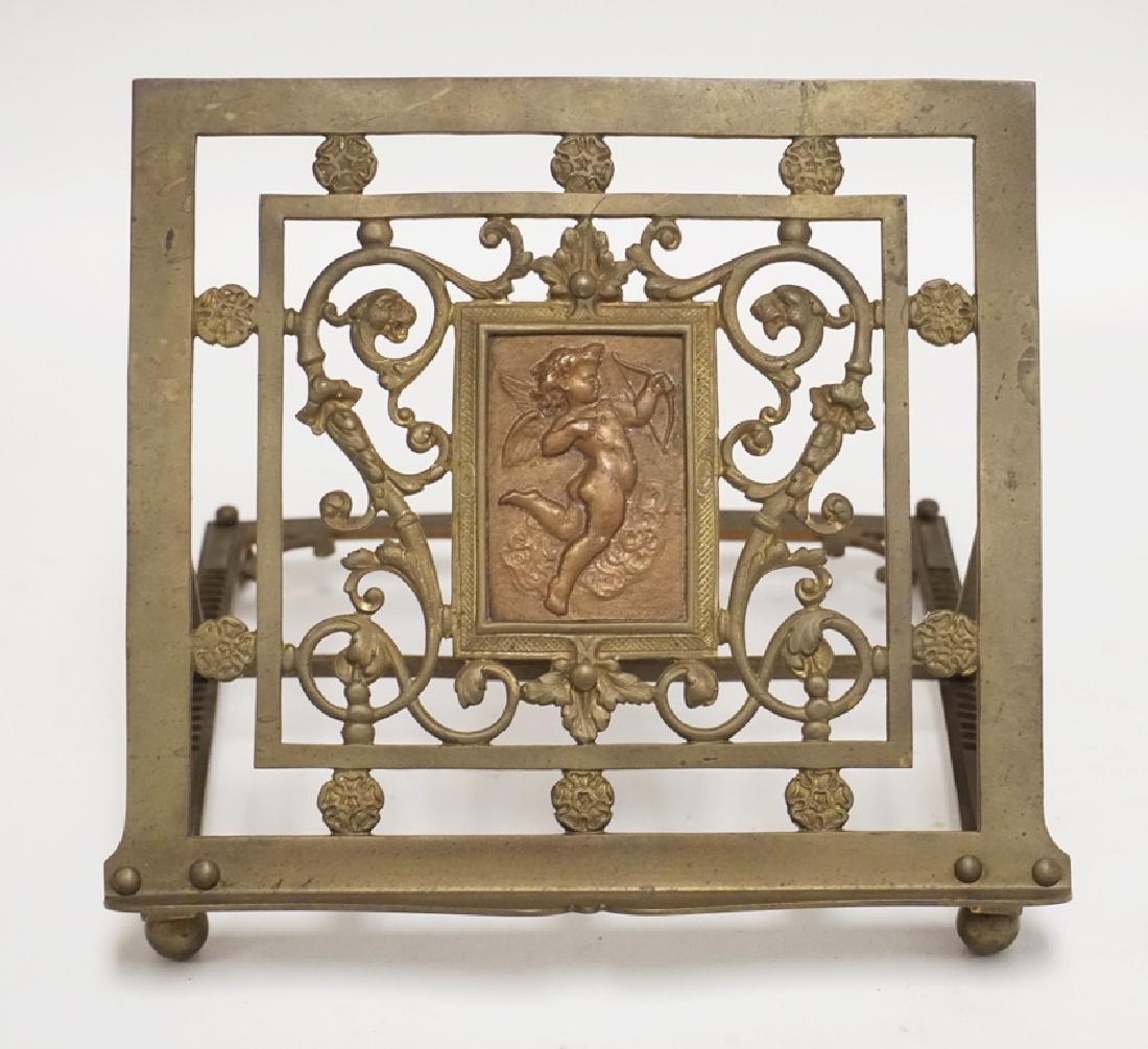 ORNATE BRASS BOOKSTAND WITH A RELIEF DECRATED PANEL IN (1 of 3)