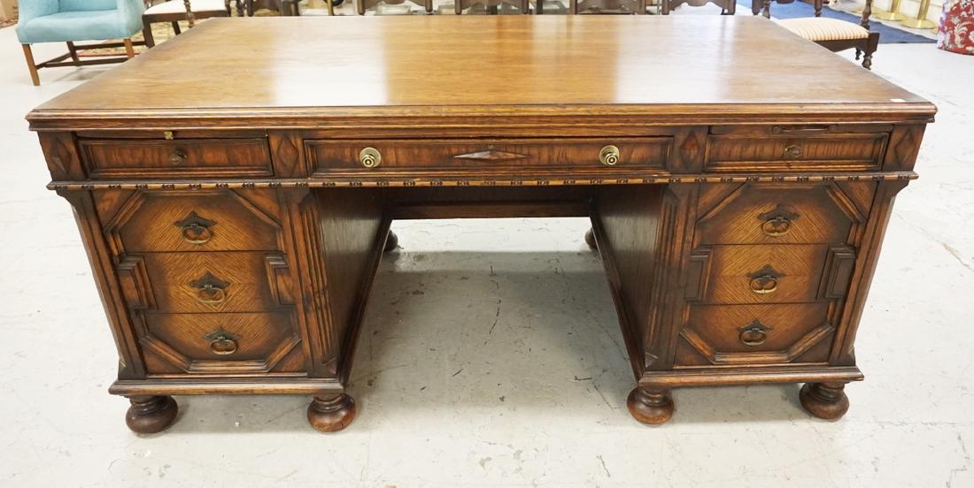 OAK KNEEHOLE DESK WITH 8 DRAWERS AND PULL OUT SURFACES.: OAK KNEEHOLE DESK WITH 8 DRAWERS AND PULL OUT SURFACES. 66 IN X 36 IN, 30 1/2 IN H