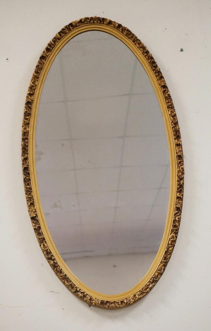 CARVED AND GOLD GILT OVAL MIRROR. 38 1/2 X 20 1/2 (1 of 2)