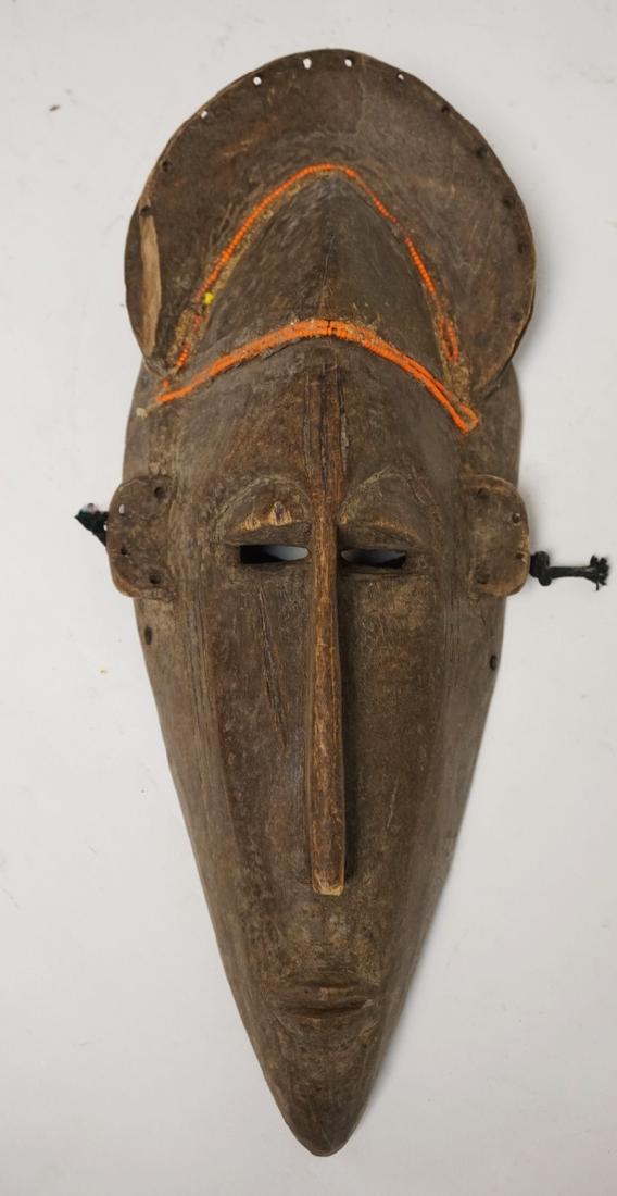 CARVED WOODEN MASK WITH MEADED DECORATION. 14 1/2: CARVED WOODEN MASK WITH MEADED DECORATION. 14 1/2 INCHES LONG.