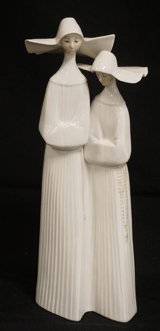 LLADRO PORCELAIN FIGURE OF TWO NUNS. 13 INCHES HIGH.