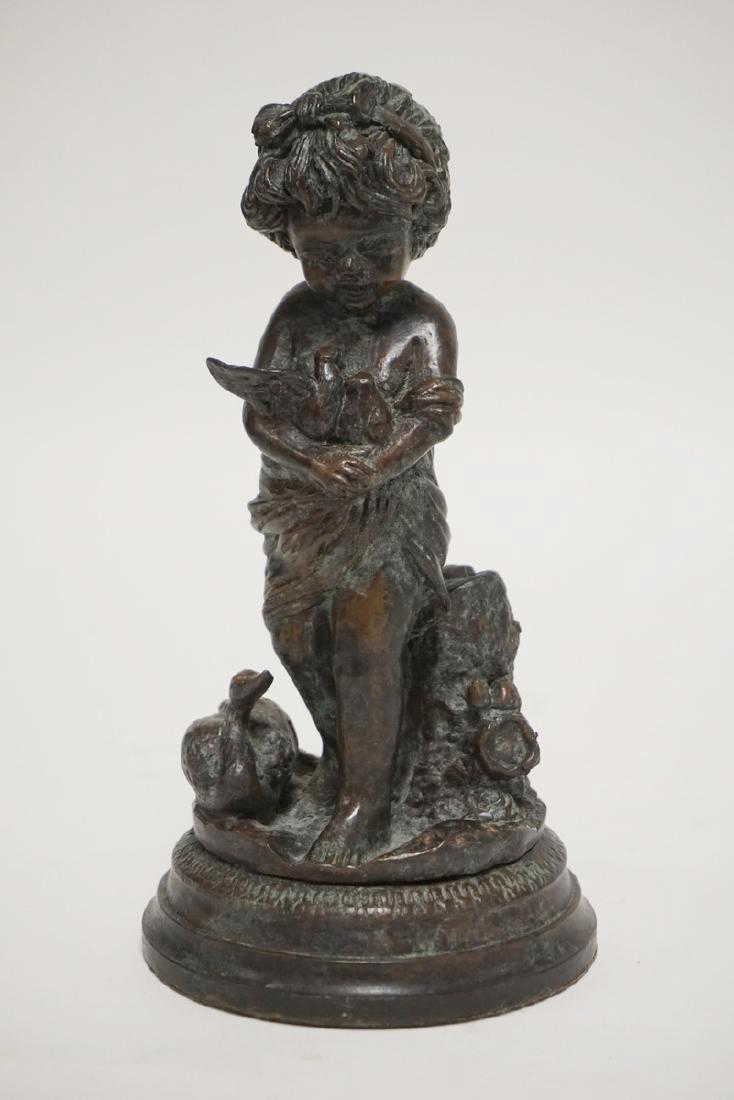 MAITLAND SMITH SCULPTURE OF A YOUNG GIRL HOLDING DOVES.