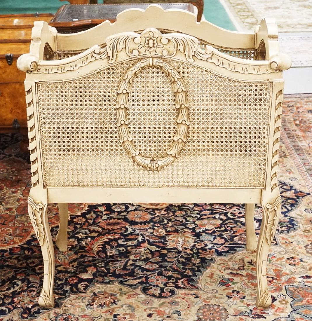 CARVED CRIB/PLANT STAND WITH CANED SIDES. 31 X 17 AND: CARVED CRIB/PLANT STAND WITH CANED SIDES. 31 X 17 AND 37 INCHES HIGH.