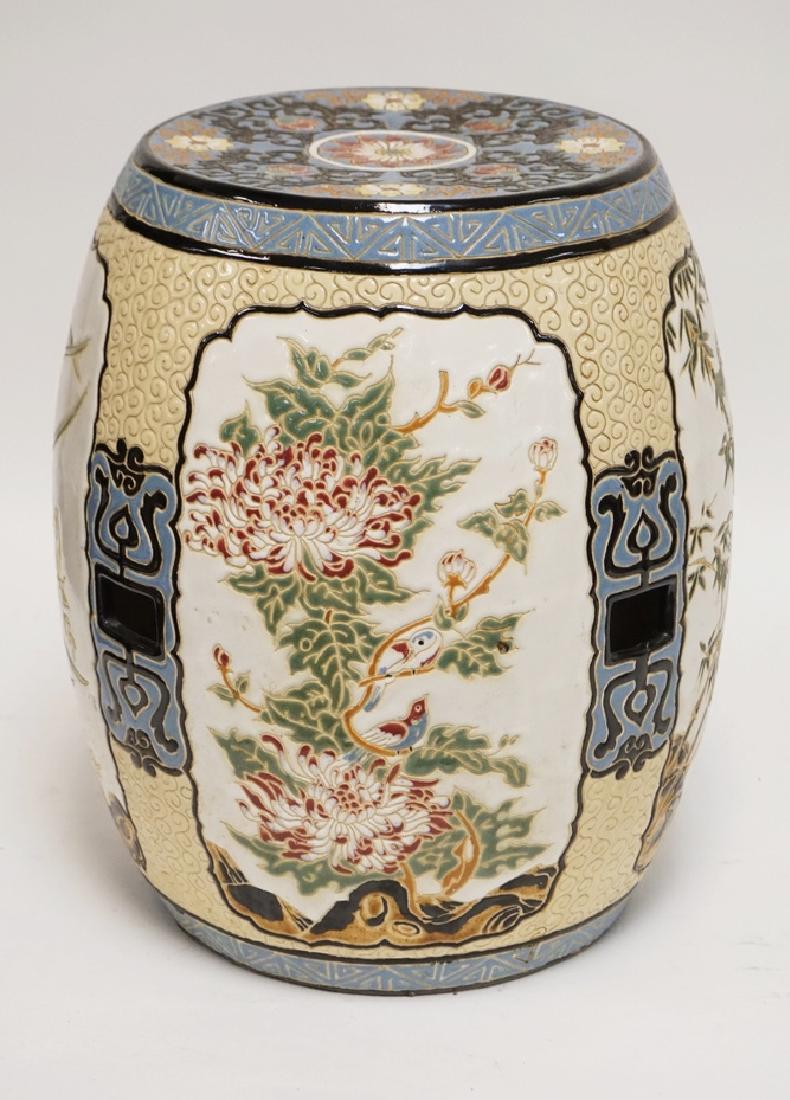 POTTERY GARDEN SEAT DECORATED WITH IMAGES OF BIRDS,: POTTERY GARDEN SEAT DECORATED WITH IMAGES OF BIRDS, BUTTERFLIES, AND FLOWERING TREES. 16 INCHES HIGH.