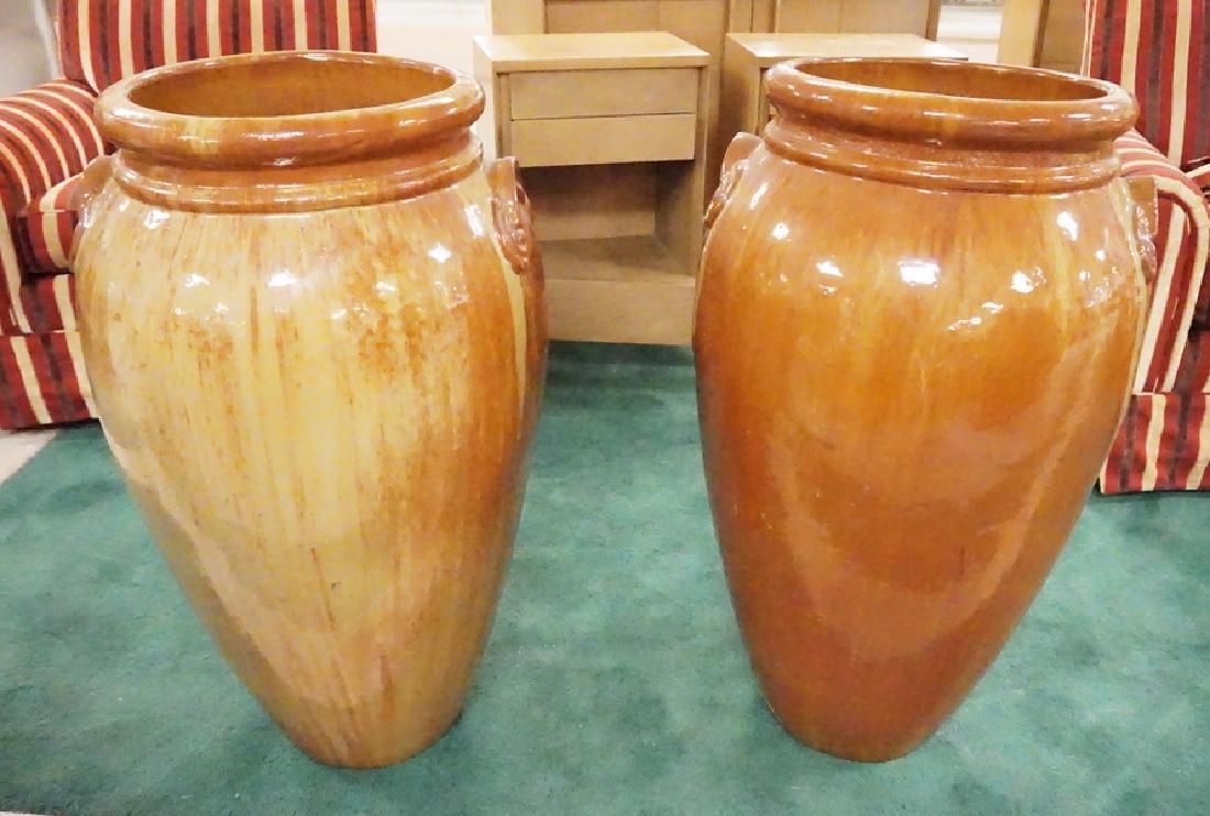 PAIR OF POTTERY FLOOR VASES. (1 of 2)