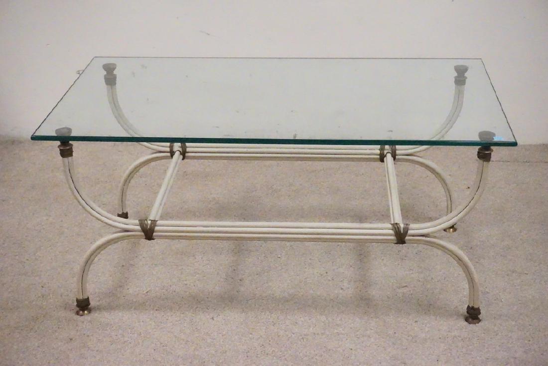 IRON AND BRASS COFFEE TABLE WITH A GLASS TOP.: IRON AND BRASS COFFEE TABLE WITH A GLASS TOP.