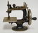 ANTIQUE CAST IRON SINGER CHILDS TOY SEWING MACHINE.