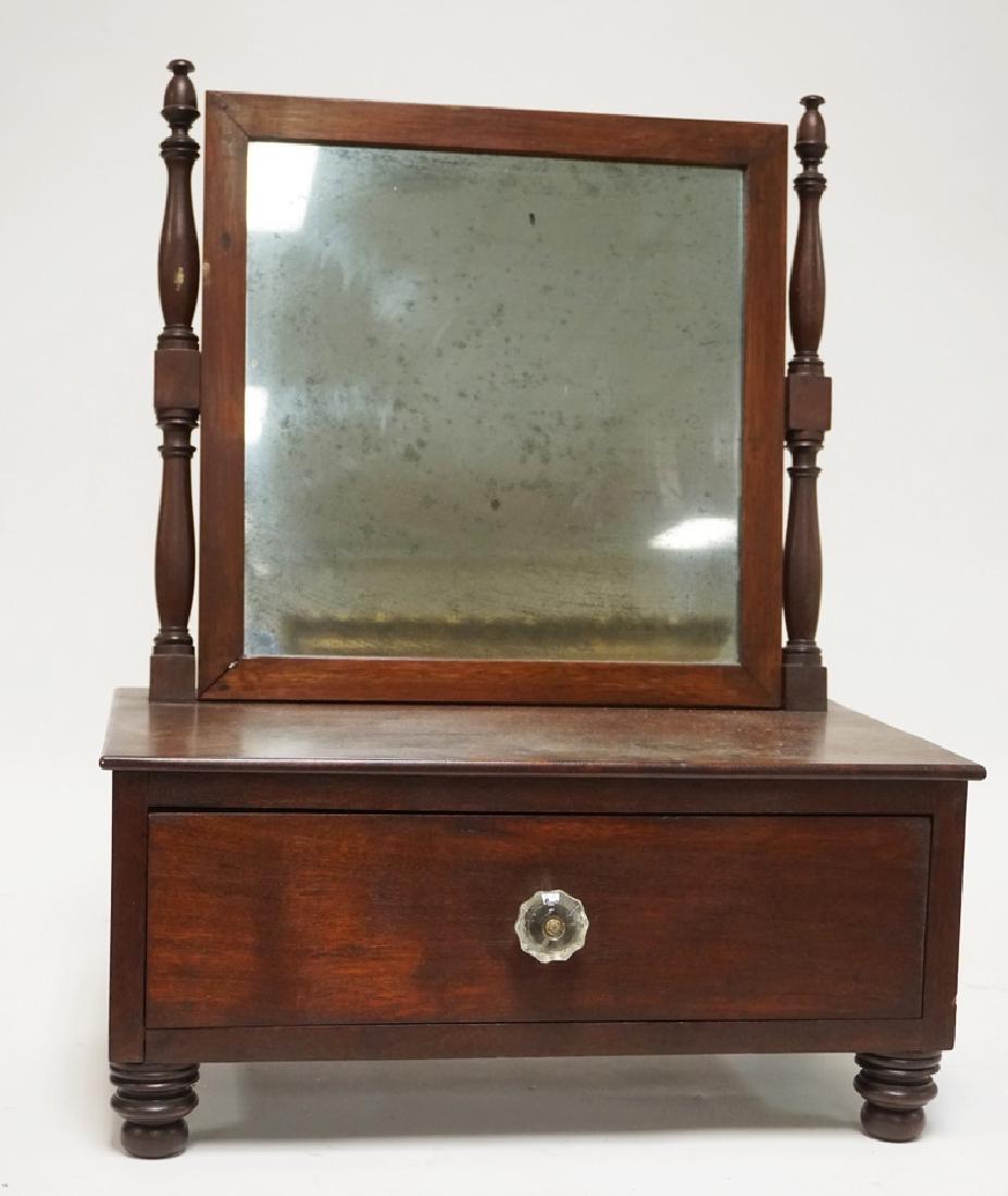 ANTIQUE MAHOGANY HAVING MIRROR WITH TURNED FEET. 16 3/4: ANTIQUE MAHOGANY HAVING MIRROR WITH TURNED FEET. 16 3/4 INCHES WIDE. 21 1/2 INCHES HIGH.