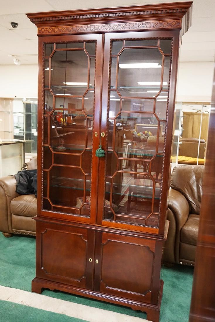 NATIONAL TRUST MAHOGANY CHINA CABINET WITH LIGHTING AND: NATIONAL TRUST MAHOGANY CHINA CABINET WITH LIGHTING AND GLASS SHELVES. HAS 2 BLIND DOORS AT THE BASE. 44 3/4 IN WIDE, 86 IN HIGH