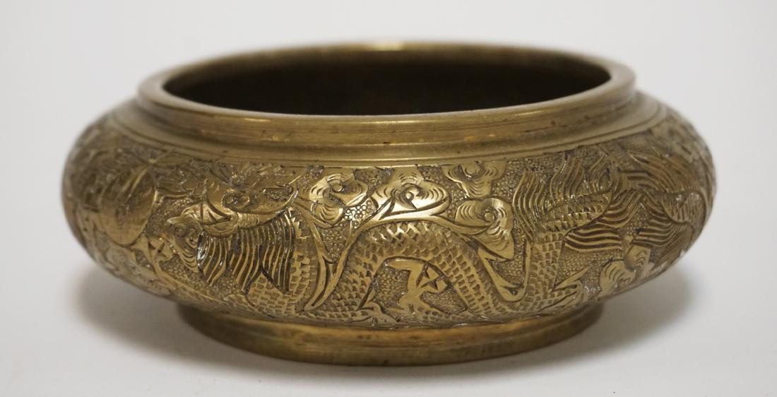 ASIAN BRONZE BOWL DECORATED WITH DRAGONS. CHARACTER (1 of 2)