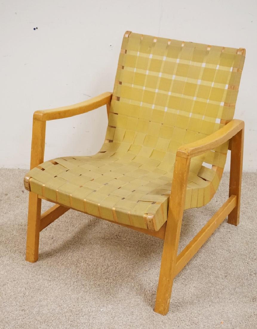 MID CENTURY LOUNGE CHAIR WITH A WOVEN SEAT AND BACK.: MID CENTURY LOUNGE CHAIR WITH A WOVEN SEAT AND BACK. POSSIBLY KNOLL. 29 INCHES HIGH. 24 INCHES WIDE.