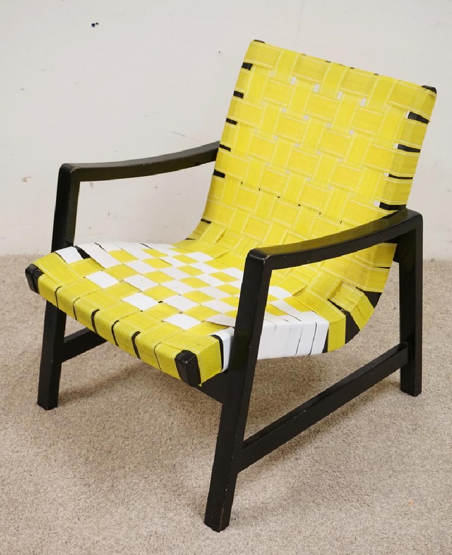 MID CENTURY LOUNGE CHAIR WITH A WOVEN SEAT AND BACK.: MID CENTURY LOUNGE CHAIR WITH A WOVEN SEAT AND BACK. POSSIBLY KNOLL. 29 INCHES HIGH. 24 INCHES WIDE.