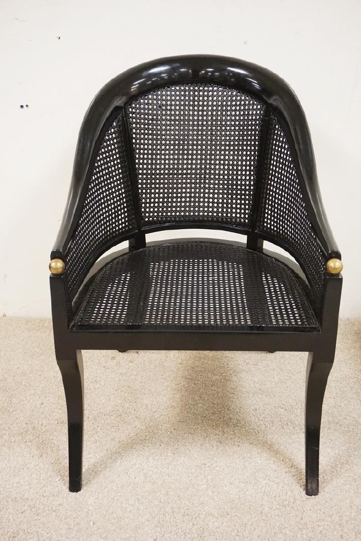 BLACK LACQUERED ARMCHAIR. CANED SEAT AND BACK. HAS A: BLACK LACQUERED ARMCHAIR. CANED SEAT AND BACK. HAS A CUSHION THAT NEEDS A COVER.