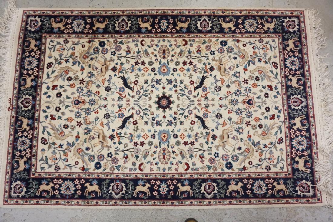 HAND WOVEN ORIENTAL RUG FEATURING ANIMALS AND BIRDS.