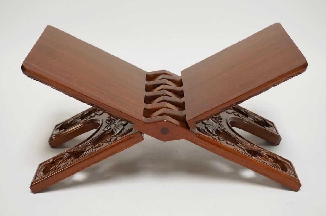 CARVED FOLDING BOOK STAND. 14 1/2 INCHES WIDE. 7 1/4: CARVED FOLDING BOOK STAND. 14 1/2 INCHES WIDE. 7 1/4 INCHES HIGH.