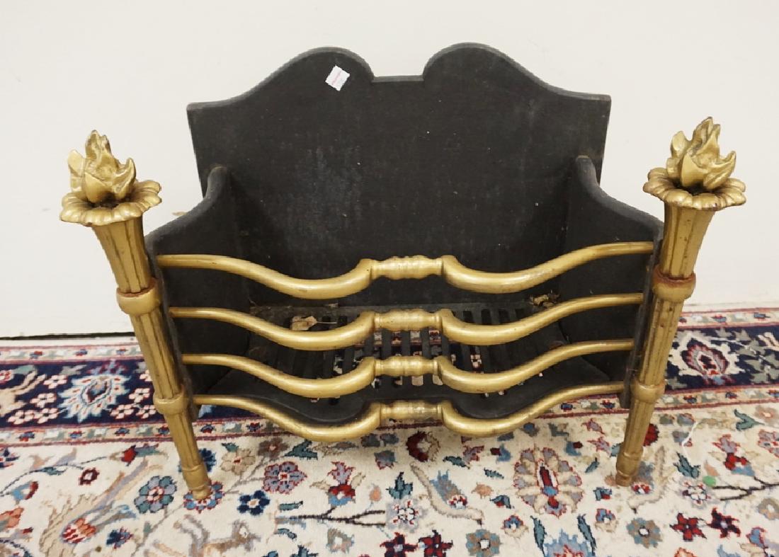 BRONZE AND IRON FIREPLACE GRATE. 21 INCHES WIDE. 17: BRONZE AND IRON FIREPLACE GRATE. 21 INCHES WIDE. 17 INCHES HIGH.