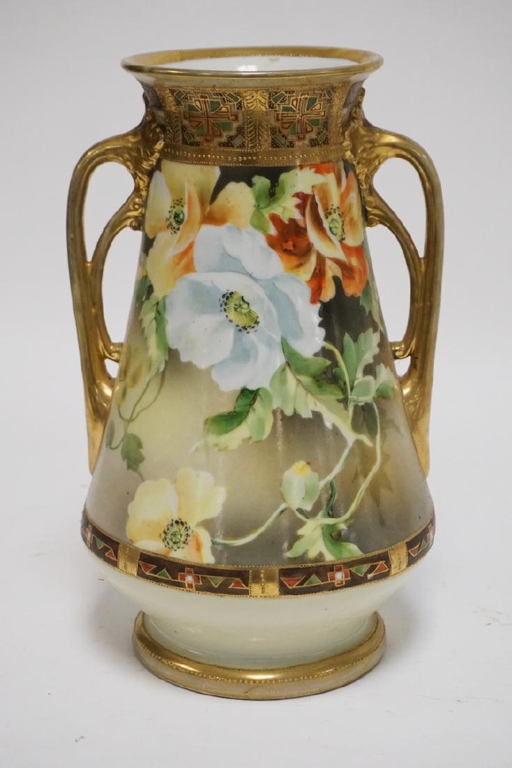 NIPPON: UNMARKED NIPPON PORCELAIN VASE DECORATED WITH FLOWERS. DRILLED TO BE LAMPED. 12 1/2 INCHES HIGH.